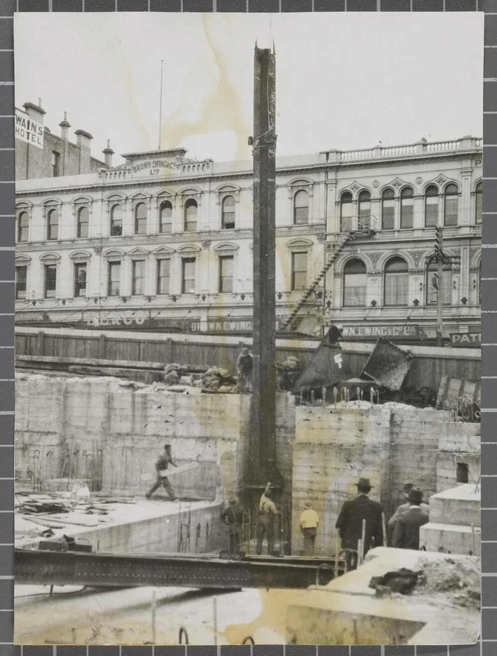 'G.P.O. [General Post Office] Dunedin Lowering first Stanchion into place 19.2.34'
