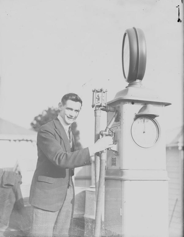 Europa. Man at Petrol Bowser. ( Petrol Pump ). New Zealand.