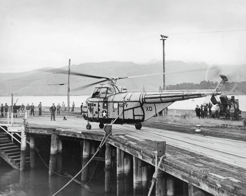 Navy. Aviation. US Navy Helicopter. Sikorsky H-19, Chickasaw. On the Wharf at Lyttelton, Operation Deep Freeze Expedition to Antarctica. Canterbury, New Zealand. ( Shortly before it Crashed into the Harbour).