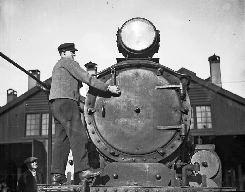 Railway. Man Working on Smokebox Door of an A Class Locomotive at Depot, Christchurch, Canterbury, New Zealand.