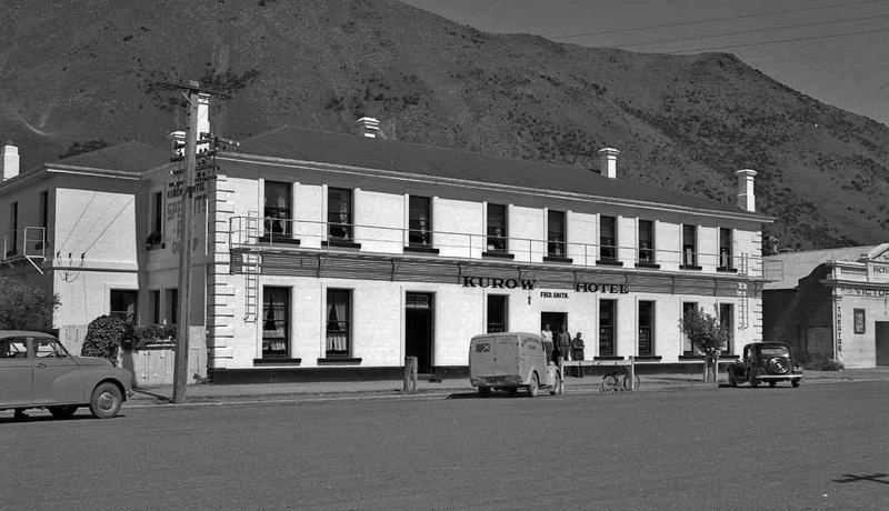 Building. Hotel. Kurow Hotel. Note Hitching Post for Horses in Front of the Cars. Kurow, Otago, New Zealand.