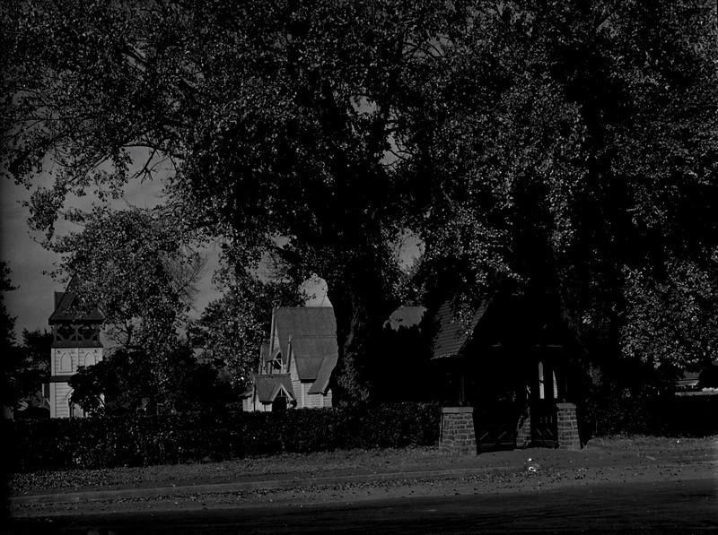 Church, St Mary the Virgin, Anglican Church. with Separate Wooden Bell Tower and Lych-Gate Through a Holly Hedge. Church Square. Addington, Christchurch, Canterbury, New Zealand.