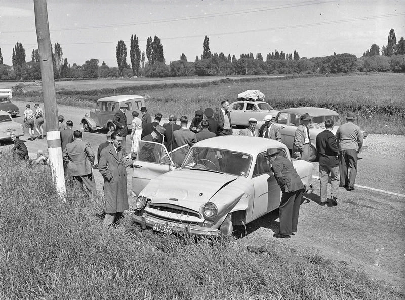Motor Vehicle Accident Rural Area. Multiple Vehicles in Car Crash, Car in Front is a Standard Vanguard . Onlookers Gather. Canterbury, New Zealand.