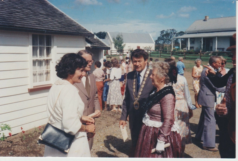 Diana Litten, Alan Highet and Morrin Cooper talking with a lady in costume