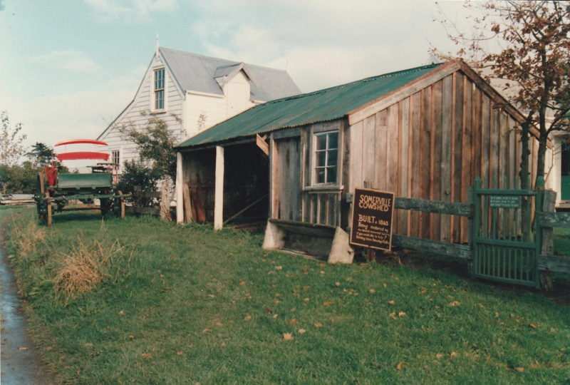 Somerville's cowshed in the Howick Historical Village. A gig is on the grass near the Coachhouse.