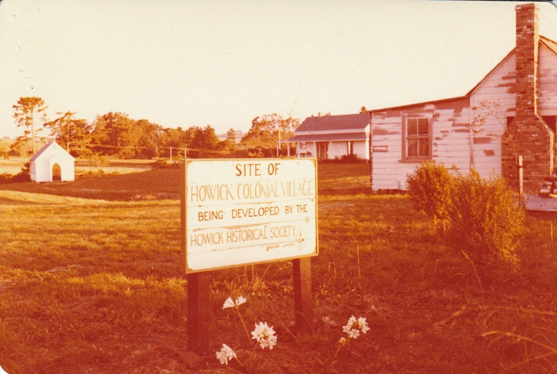Looking aross the site io the Howick Colonial Village from Bells Road, showing the Church, Parsonage and Sergeat Ford's cottage awaiting restoration.