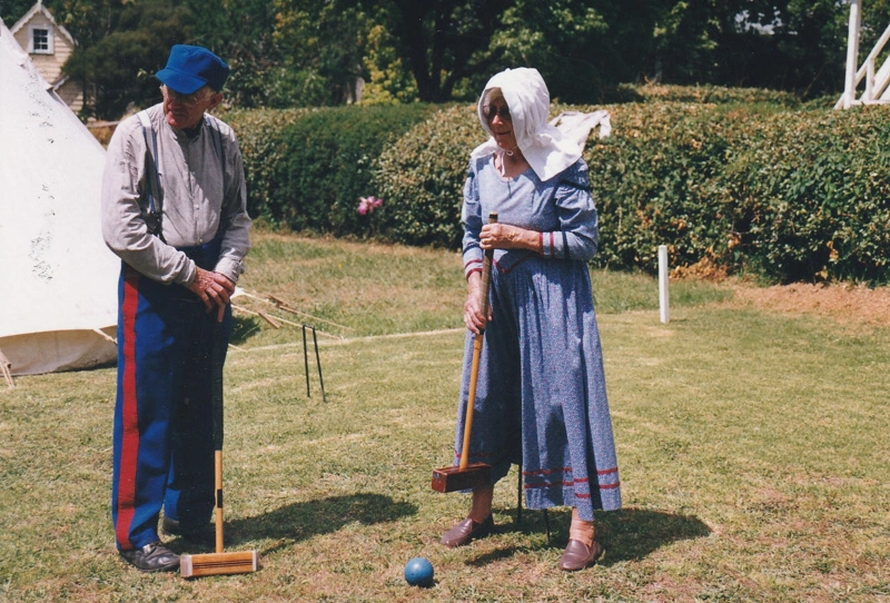 Alan la Roche and a lady, both in costume playing croquet on a Live Day in Howick Historical Village.