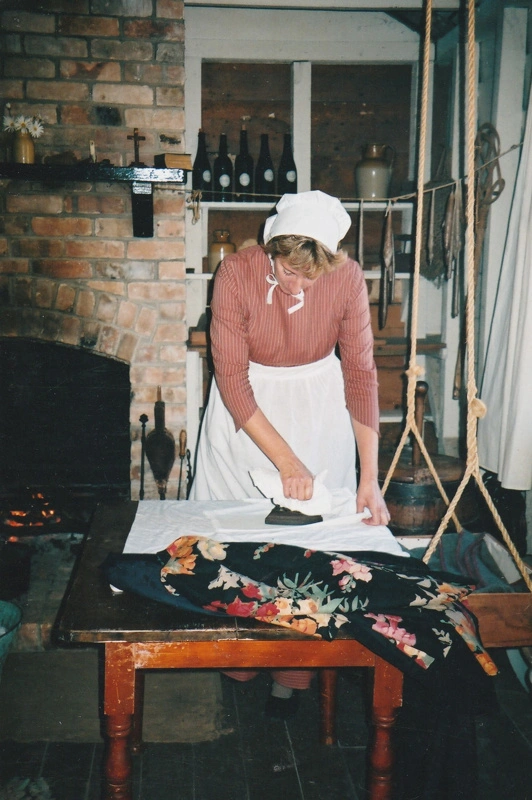 Tracy Mulgrew ironing in Briody-McDaniel's cottage.