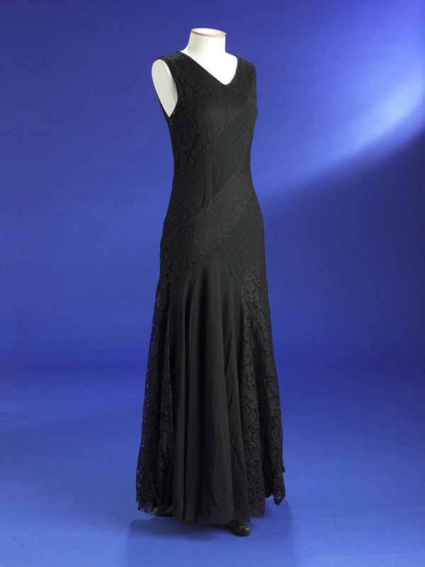 Evening dress; black silk georgette with lace panels