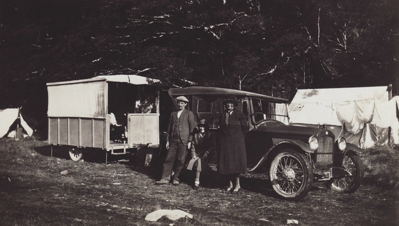 Photograph [Family with Car parked in front of an early Caravan]