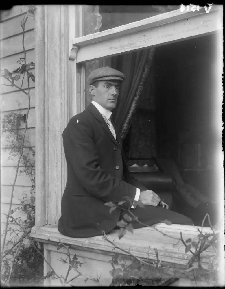 Man seated on a window ledge