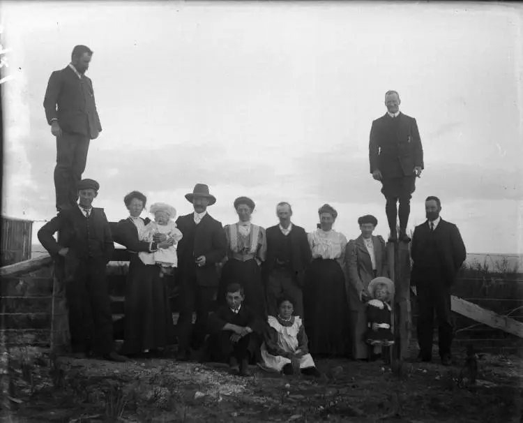 Group by a farm gate at Broadlands, 1907