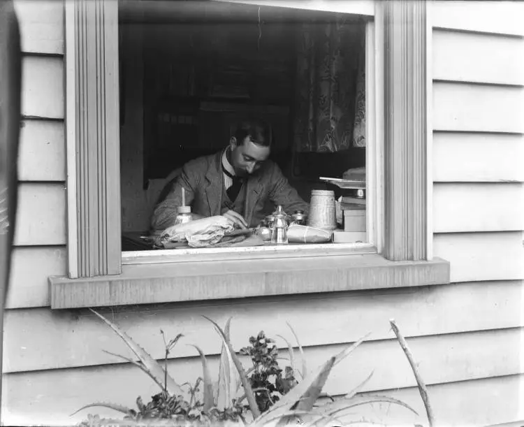 Man working at his desk, Arney Road, Remuera, 1907