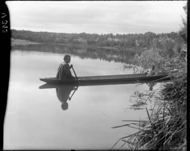 Woman in a waka on the Waikato River at Broadlands, 1908