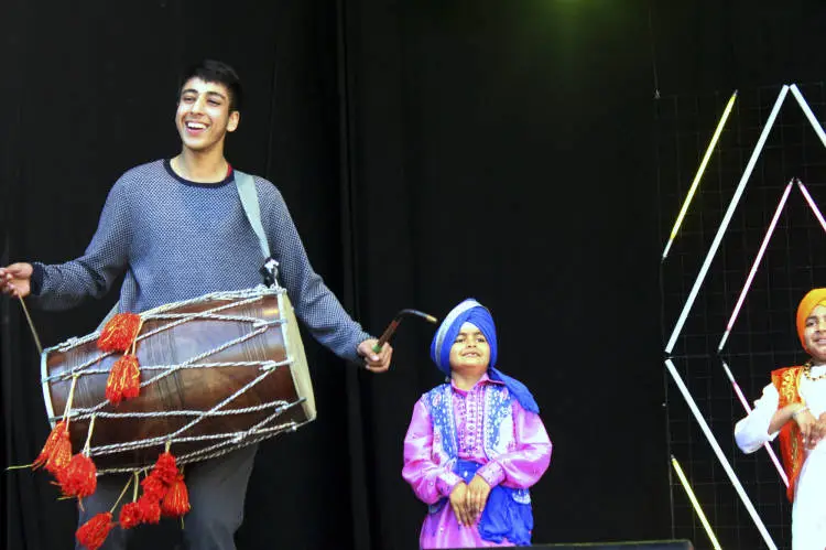 Groups doing Bhangra dancing.