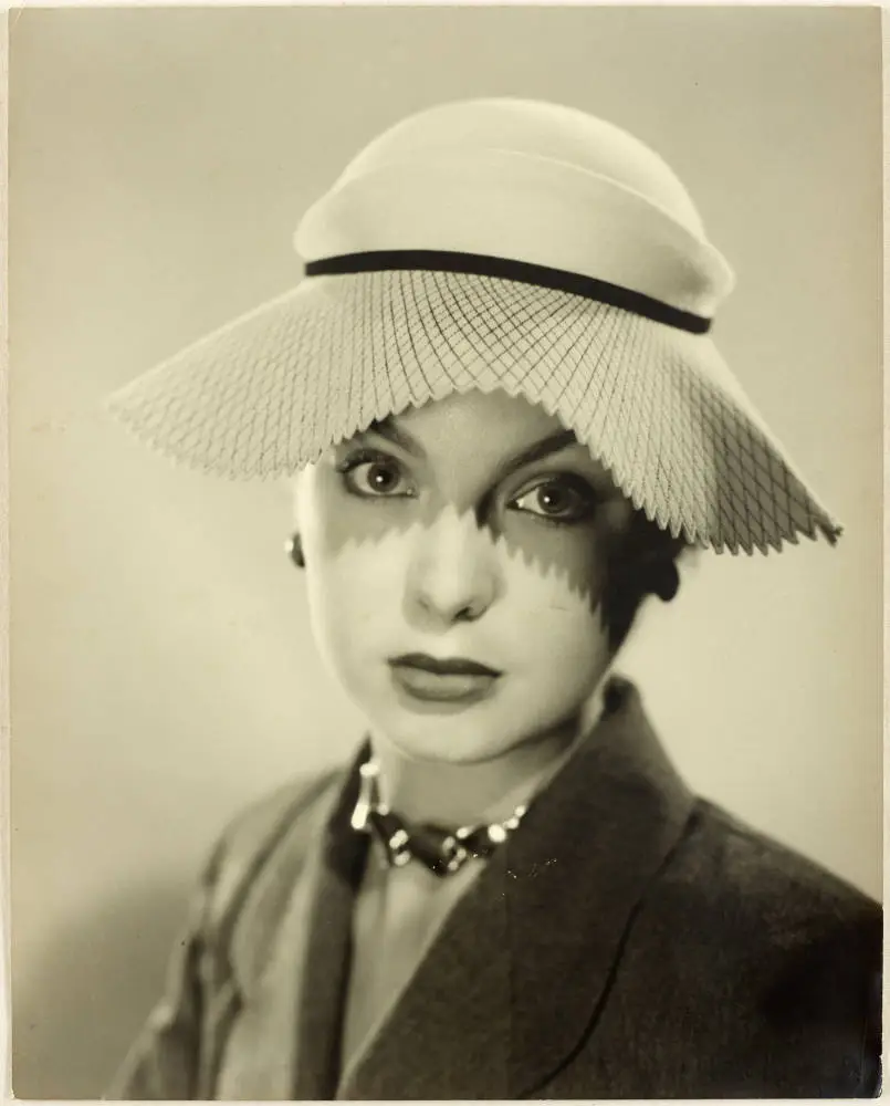 Woman modelling a hat, 1950s