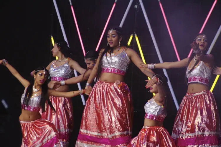 Groups doing Bollywood dancing.