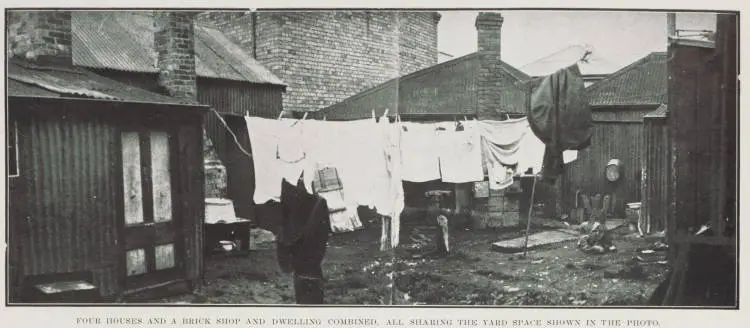 Four houses and a brick shop and dwelling combined, all sharing the yard space shown in the photo