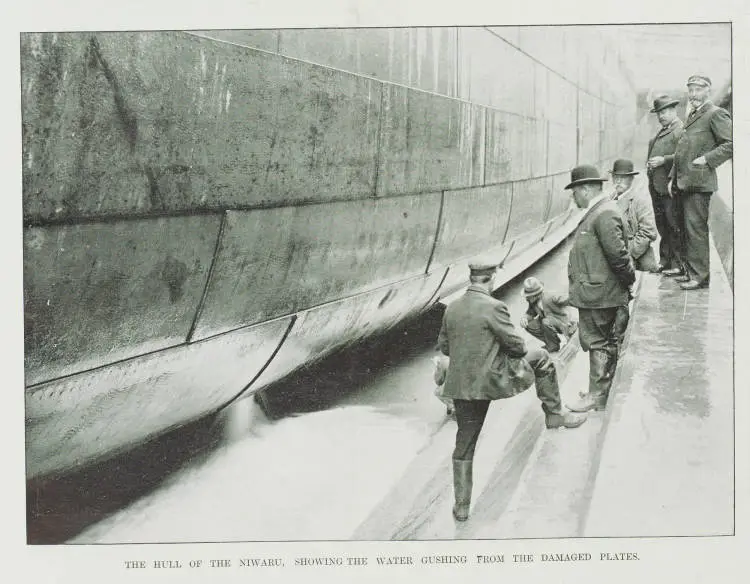 The hull of the Niwaru, showing the water gushing from the damaged plates