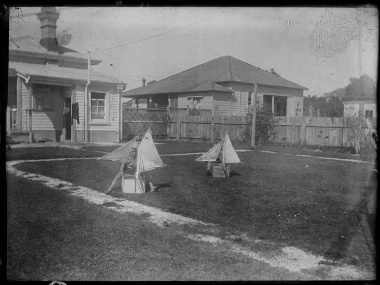 Children playing in the backyard of 5 Summer Street, Stanley Point