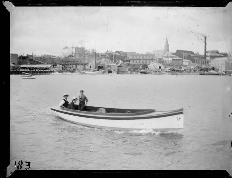 Three men in a launch, Freemans Bay