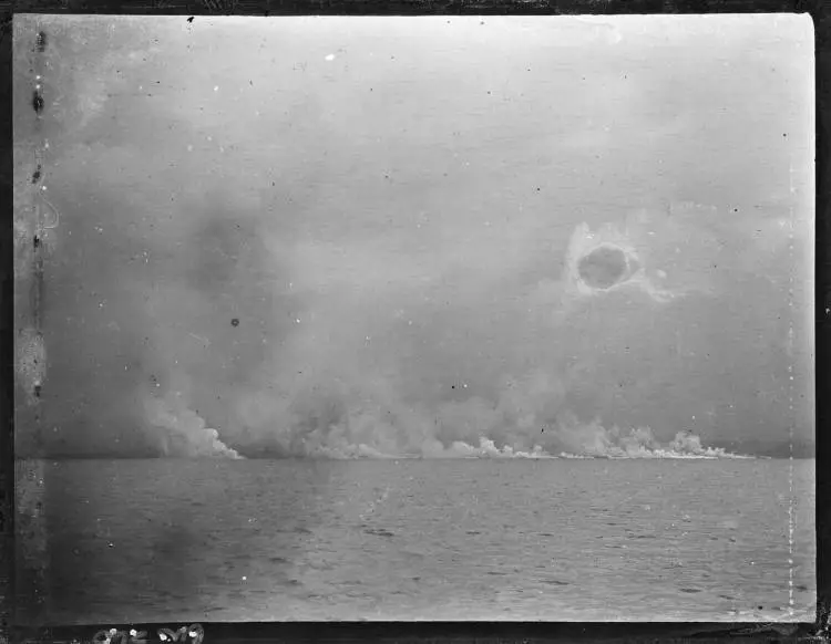 Shoreline obscured by smoke or steam