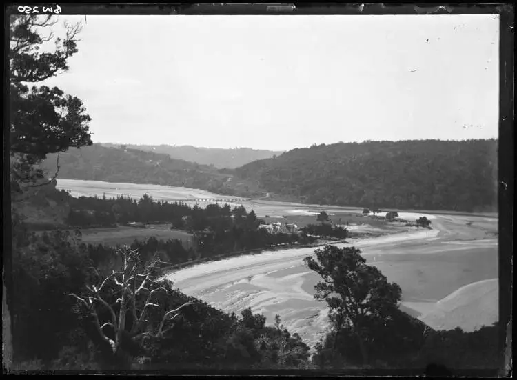 Waiwera Beach and bridge over the Waiwera River