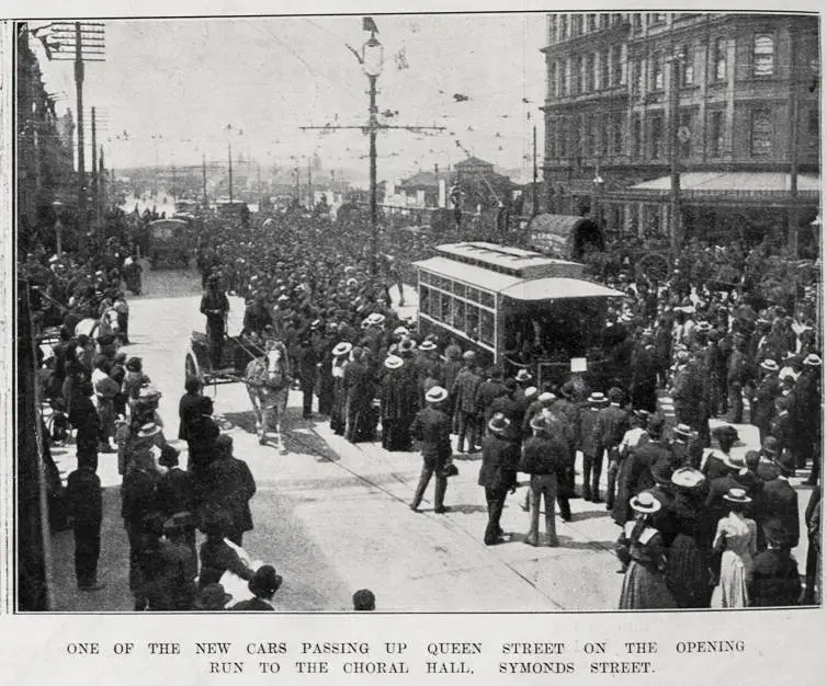 One of the new tram cars passing up Queen Street, Auckland on the opening run to the Choral Hall, Symonds Street