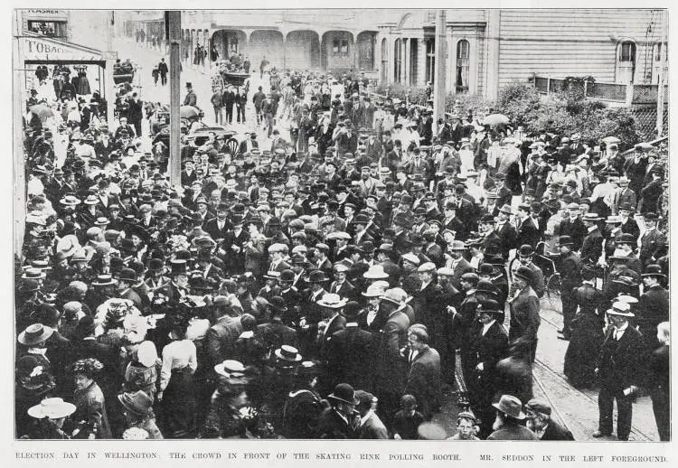 Election day in Wellington with the crowd gathered in front of the skating rink polling booth, Mr Seddon( left foreground)