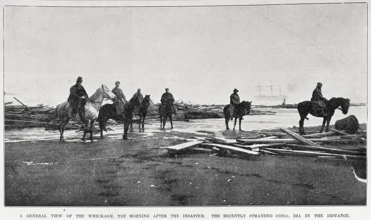 A general view of the wreckage the morning after the disaster, the recently stranded 'Concordia' in the distance