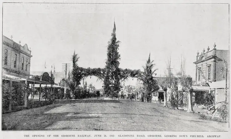 Gladstone Road looking towards the decorated fire bell archway for the opening of the Gisborne-Auckland railway, 26 June 1902