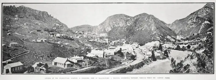OPENING OF THE PAEROA-WAIHI RAILWAY: A PANORAMIC VIEW OF KARANGAHAKE, A THRIVING GOLDMINING TOWNSHIP, THROUGH WHICH THE RAILWAY PASSES