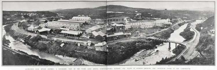 AUCKLAND'S GOLD MINING CENTRES: A PANORAMIC VIEW OF THE WAIHI GOLD MINING COMPANYICTORIA BATTERY AND PLANT AT WAIKINO, SHOWING THE OHINEMURI RIVER IN THE FOREGROUND