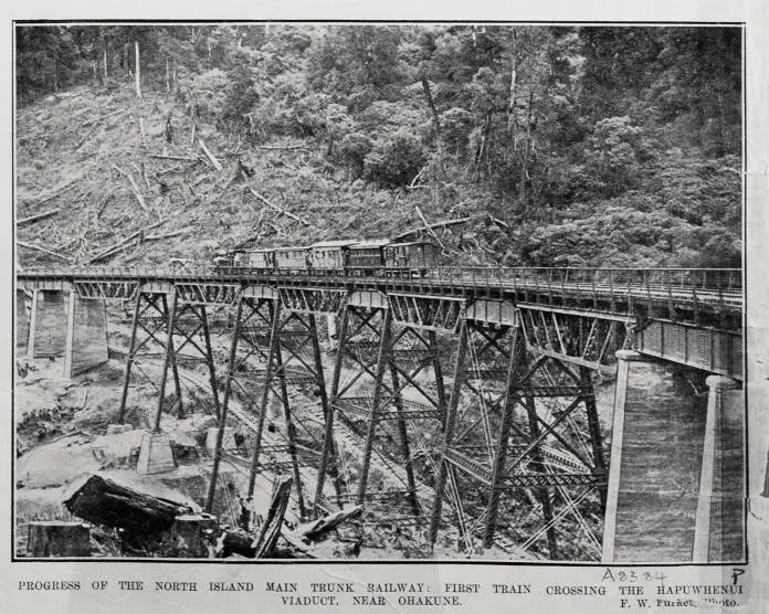 PROGRESS OF THE NORTH ISLAND MAIN TRUNK RAILWAY: FIRST TRAIN CROSSING THE HAPUWHENUI VIADUCT, NEAR OHAKUNE