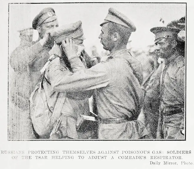 Russians protecting themselves against poisonous gas: soldiers of the Tsar helping to adjust a comrade's respirator