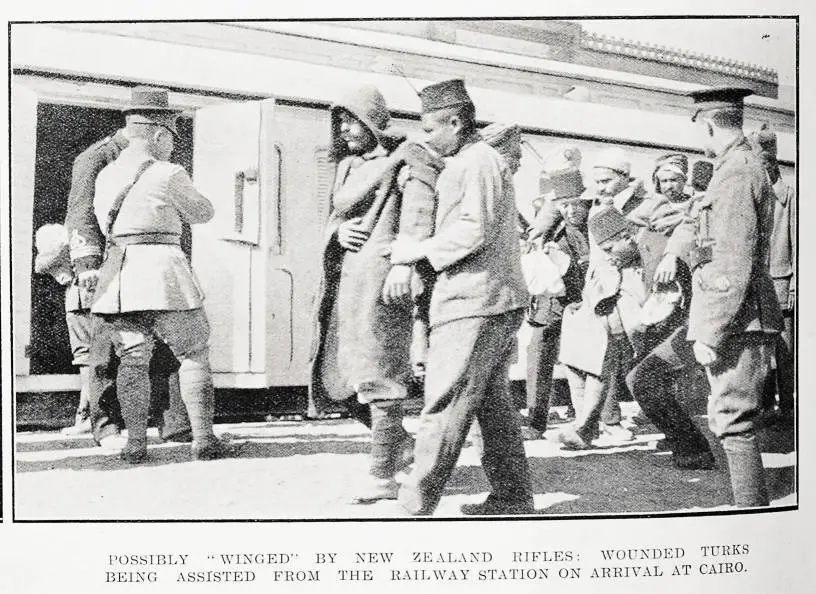 Possibly 'winged' by New Zealand rifles: wounded Turks being assisted from the railway station on arrival at Cairo