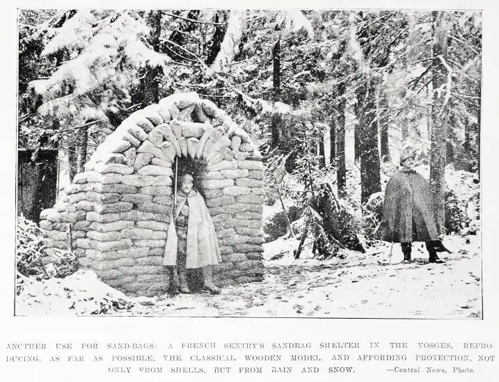 Another use for sand-bags: a French sentry's sandbag shelter in the Vosges, reproducing as far as possible, the classical wooden model, and affording protection, not only from shells, but from rain and snow