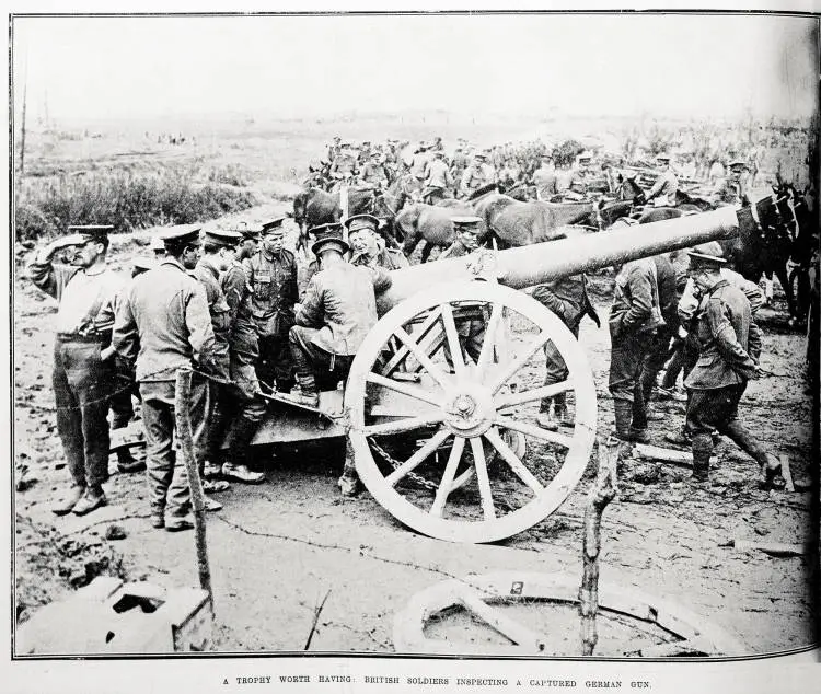 A trophy worth having: British soldiers inspecting a captured German gun