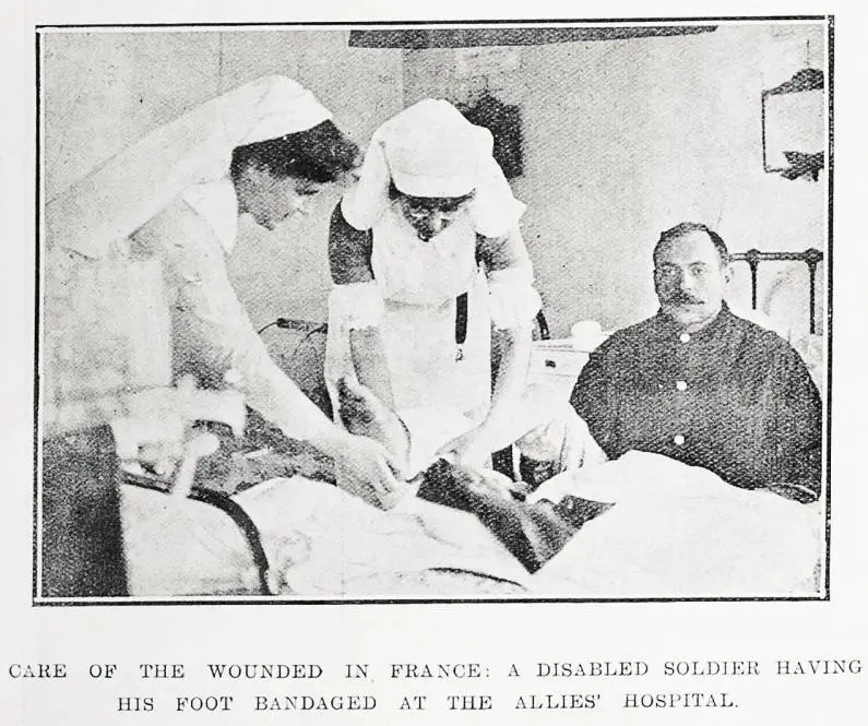 Care of the wounded in France: a disabled soldier having his foot bandaged at the Allies' Hospital