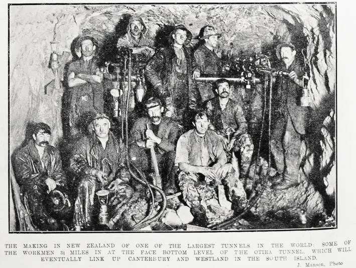 The making in New Zealand of one of the largest tunnels in the world : some of the workmen 3 1/2 miles in at the face bottom level of the Otira Tunnel, which will eventually link up Canterbury and Westland in the South Island