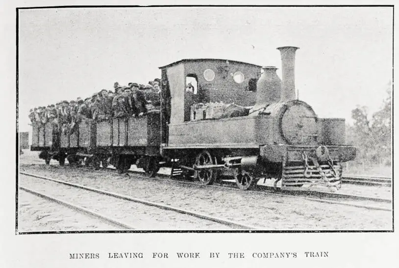 Miners leaving for work by the company's train