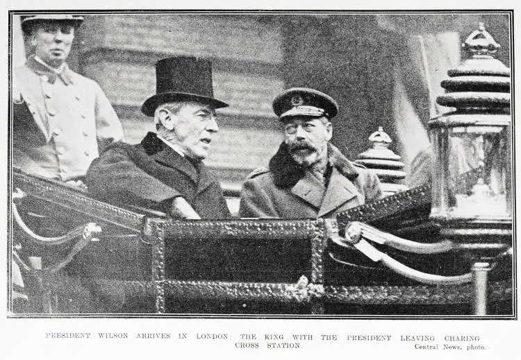 President Wilson arrives in London. The King with the President leaving Charing Cross Station