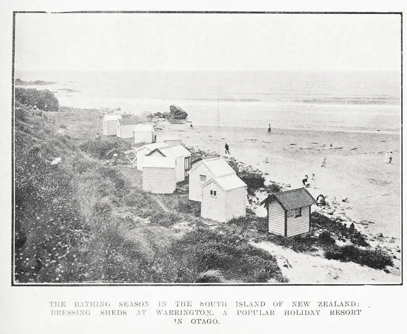 The bathing season in the South Island of New Zealand: dressing sheds at Warrington, a popular holiday resort in Otago