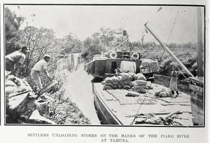 Settlers unloading stores on the banks of the Piako River at Tahuna