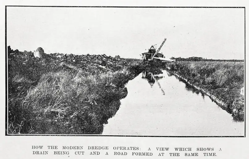 How the modern dredge operates: a view which shows a drain being cut and a road formed at the same time