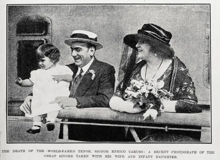 The death of the world-famed tenor, signor Enrico Caruso: a recent photograph of the great singer taken with his wife and infant daughter