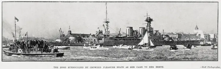The Hood surrounded by crowded pleasure boats as she came to her berth