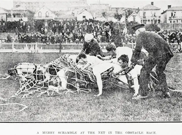 A merry scramble at the net in the obstacle race