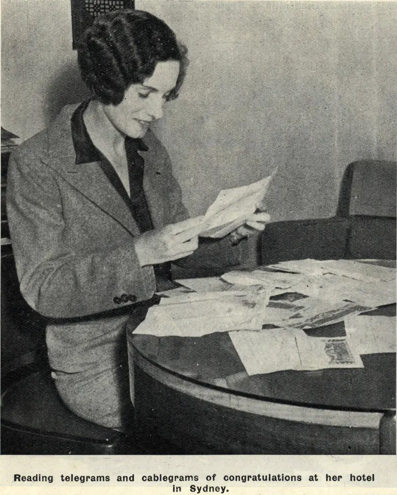Reading telegrams and cablegrams of congratulations at her hotel in Sydney