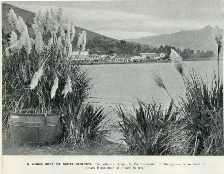 A glimpse along the Akaroa waterfront. The whaling try-pot in the foreground of the picture is one used by Captain Hempleman at Piaaka in 1835